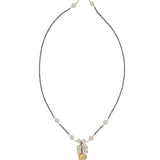 Necklace with white pearls and gold discs on a white background