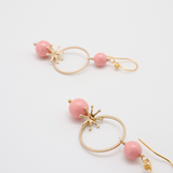 akira earrings coral