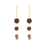 A pair of bronze-colored earrings with sequin discs and gold-filled chain, hanging from matte gold bar posts.