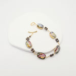 Bracelet with colorful beads on a white background
