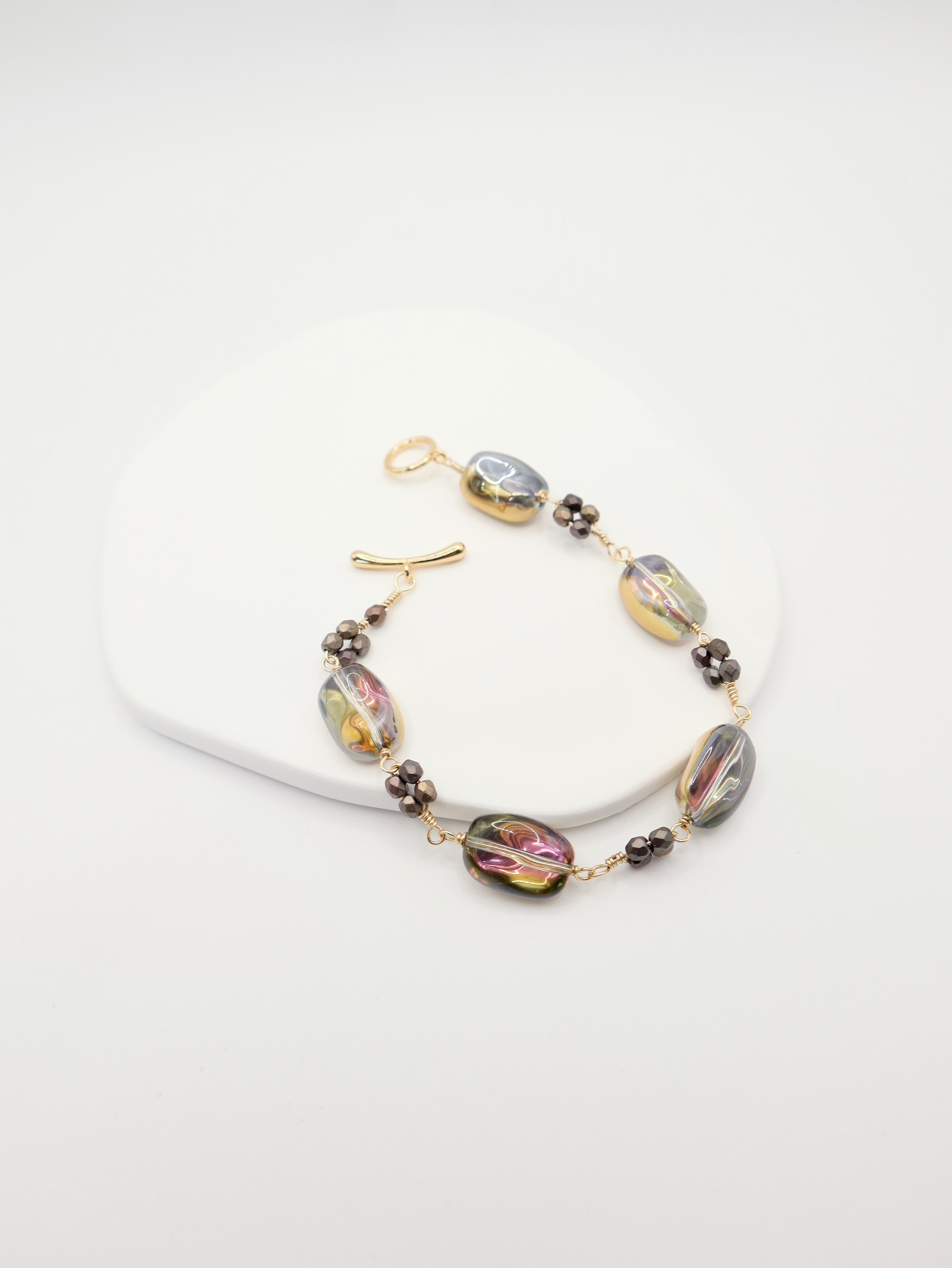 Bracelet with colorful beads on a white background