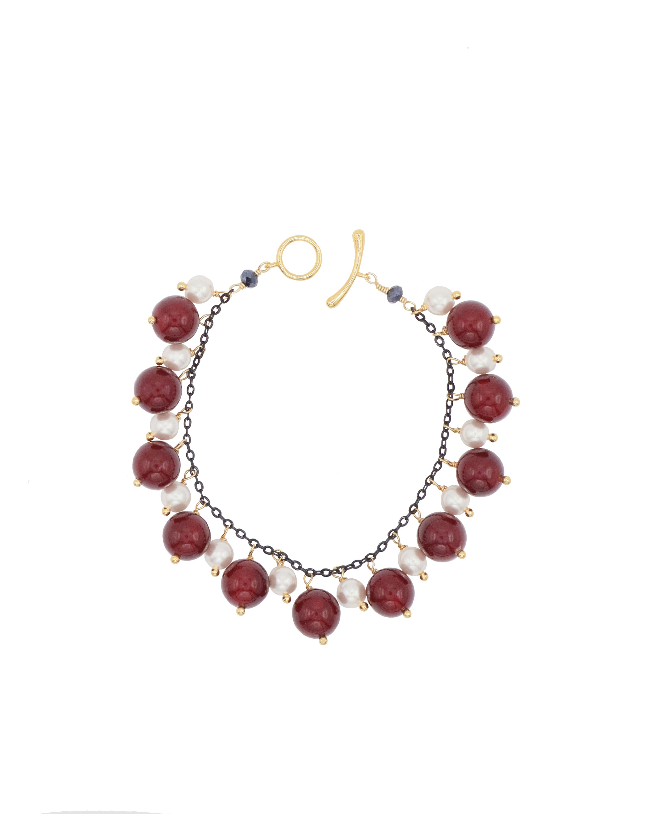 Bracelet with burgundy and white beads on a white background