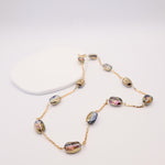 Necklace with multicolored beads on a white background