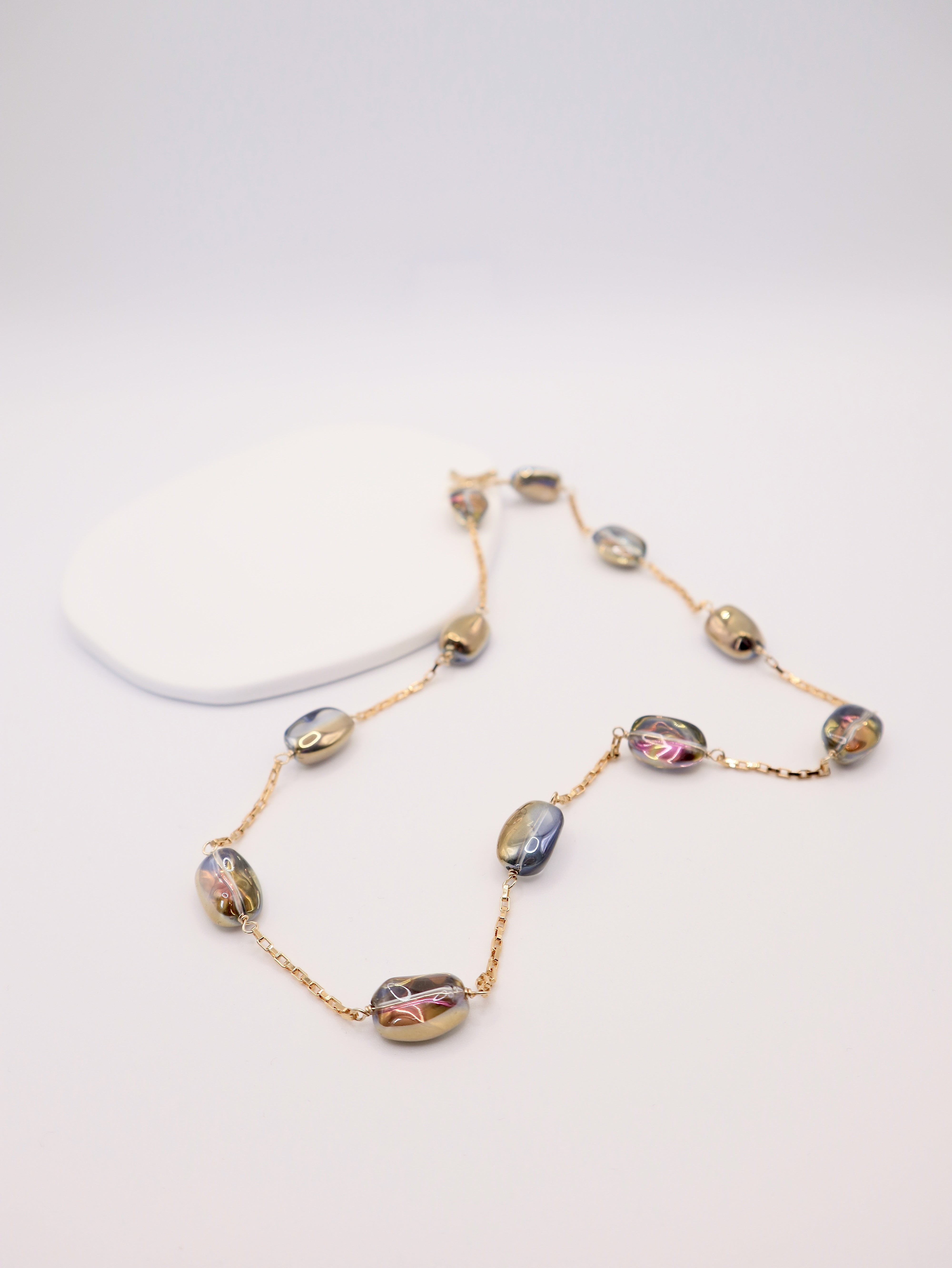 Necklace with multicolored beads on a white background