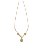 Gold necklace with pink flower on a white background