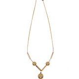 Gold necklace with pink flower on a white background