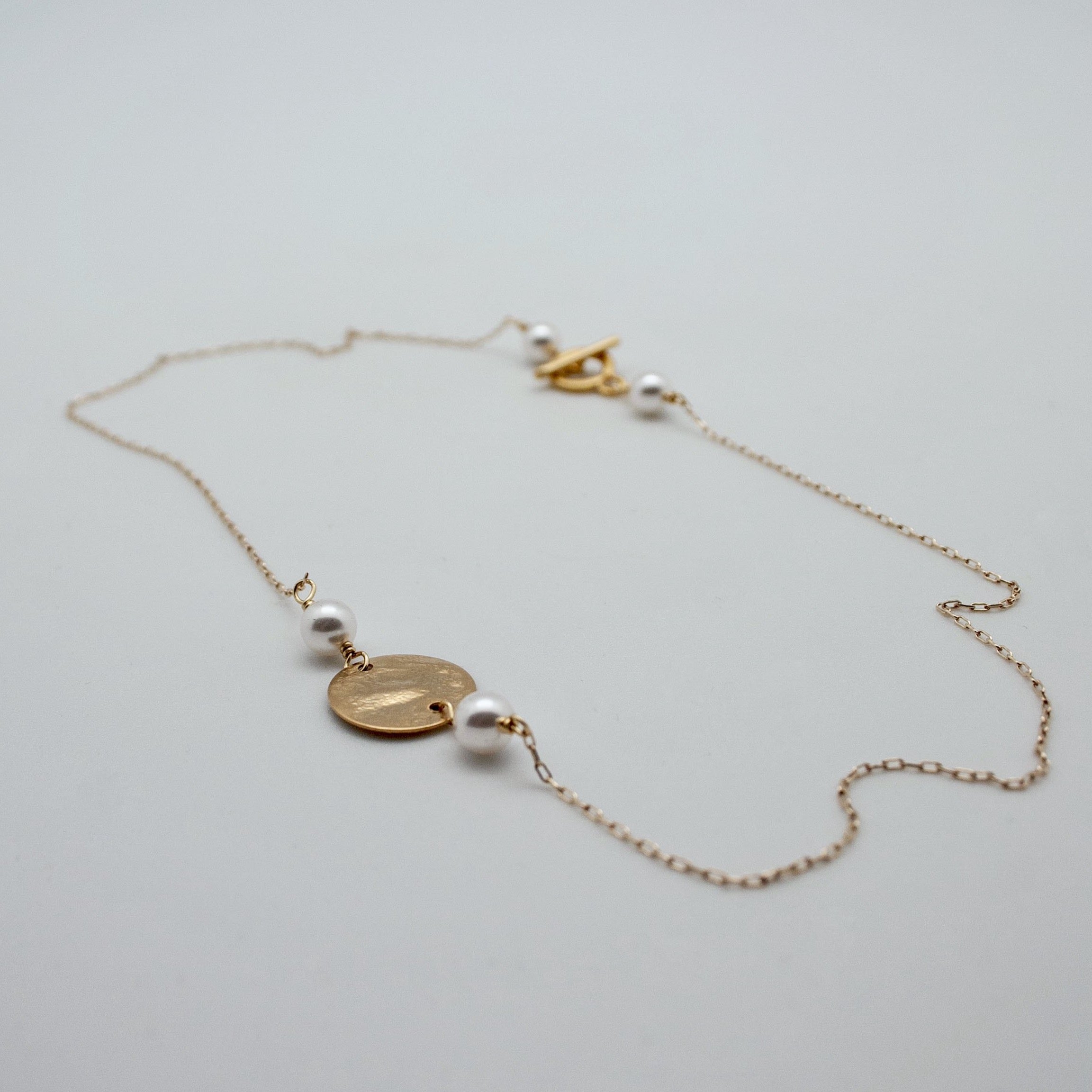 gold disc necklac ewith white pearls by vivien walsh