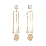Matte gold column earrings with white pearls by vivien walsh