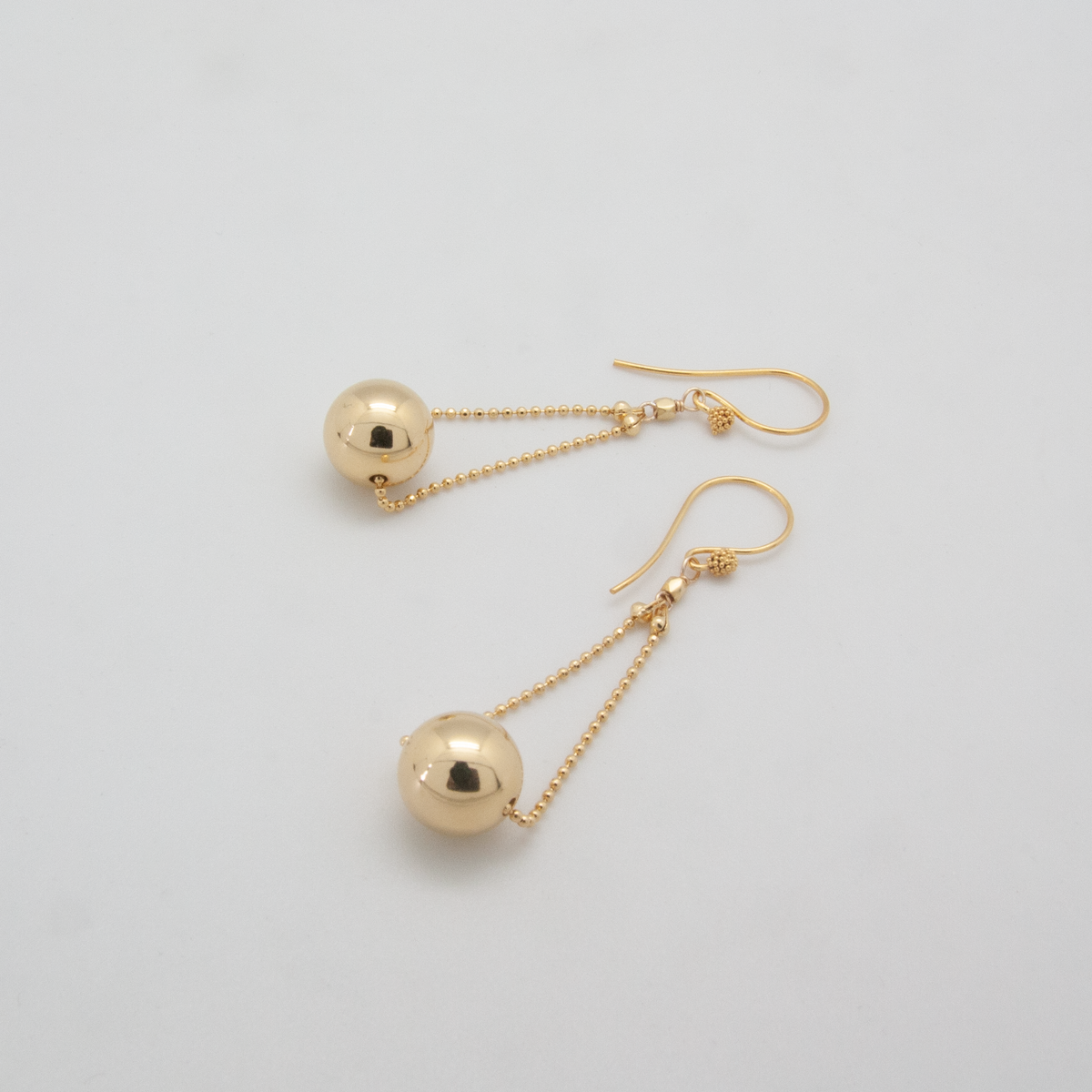 gold ball floating earrings