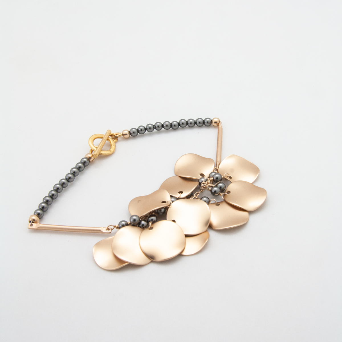 Matte gold ripple disc bracelet with grey pearls